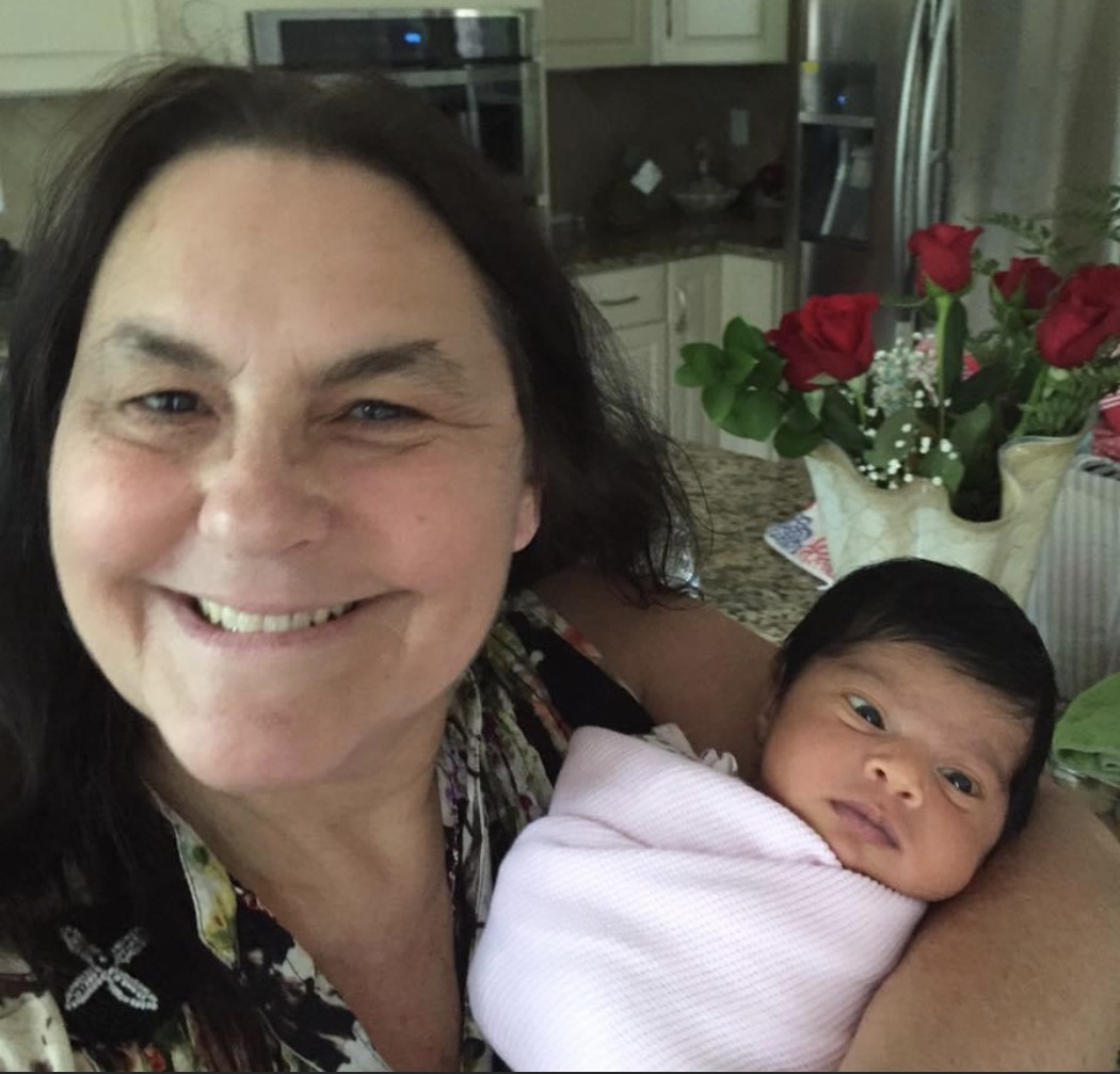 Linda holding a baby